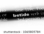 Small photo of betide word in a dictionary. betide concept.