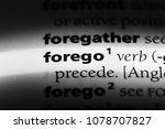 Small photo of forego word in a dictionary. forego concept
