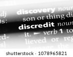 Small photo of discredit word in a dictionary. discredit concept