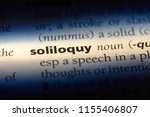 Small photo of soliloquy word in a dictionary. soliloquy concept.