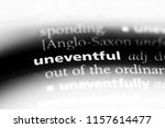 Small photo of uneventful word in a dictionary. uneventful concept.