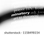 Small photo of minatory word in a dictionary. minatory concept.