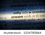 Small photo of croon word in a dictionary. croon concept, definition.