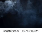 Smoke clouds create fog over top left and bottom right of black background
