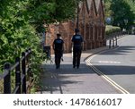 Small photo of Ironbridge,Shropshire/England - 13 Aug 2019: Two Psco's --police community support officers walking along the wharfage in Ironbridge Shropshire.