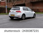 Small photo of 20th February 2024- A silver Volkswagen Golf SE Bluemotion Tdi, five door hatchback car, parked in the town center carpark at Carmarthen, Carmarthenshire, Wales, UK.