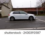 Small photo of 20th February 2024- A stylish Volkswagen Golf SE Bluemotion Tdi, five door hatchback car, parked in a public carpark in the town centre at Carmarthen, Carmarthenshire, Wales, UK.