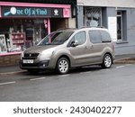 Small photo of 20th February 2024- A stylish Peugeot Partner Tepee Allure, five door MPV, parked in the town center at Carmarthen, Carmarthenshire, Wales, UK.