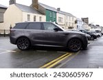 Small photo of 20th February 2024- A stylish Range Rover Sport SE PHEV Auto, five door SUV, parked on the main street in Carmarthen,Carmarthenshire, Wales, UK.