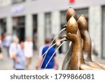 Small photo of Konstanz, Germany - July 2020: Part of fountain called 'Kaiserbrunnen' with satiric sculpture of three headed peacock with pope crown tioara, symbolising the conzil of Konstanz in 1414