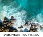 Aerial view Top down seashore. Waves crashing on rock cliff. Beautiful dark sea surface in sunny day summer background Amazing seascape top view seacoast at Intendance Beach, Mahe Seychelles