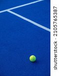 Small photo of Paddle tennis ball on a blue paddle tennis court. Racket sports