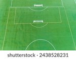 Small photo of A soccer field with two goals and a bench. The field is green and well maintained. Concept of sportsmanship and teamwork