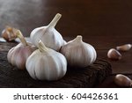 garlic bulbs on old rough wood... | Shutterstock . vector #604426361