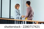 Small photo of Hiring manager shaking hands with a job candidate in an office. Female HR professional having a meeting with an applicant. Recruitment and employment in the workplace.