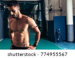 Small photo of Sportsman with motion capture sensors on body to measure the movement during sports at biomechanical lab. Movement and performance monitoring test at sports science lab.