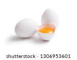 White eggs, whole and broken egg half with a yolk isolated on a white background.