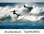 two surfers in action on the waves