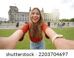 Small photo of Self portrait of nice excited school exchange girl visiting Europe within the exchange program