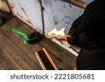 Small photo of Arsonist with petrol can at a house
