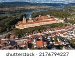 Small photo of Aerial panoramic view of Melk Abbey Monastery. Stift Melk is a Benedictine abbey in Melk, Austria. Monastery located on a rocky outcrop overlooking the Danube river and Wachau valley.