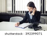 Small photo of Worried stressed office worker business woman receiving bad news phone call.Looking confused checking notes and paperwork.Manager solving mistake.Disputes,problems,Complaint,grievances at work.
