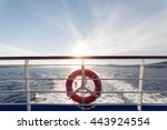 Ring life boy on big boat.Obligatory ship equipment.Personal flotation device.Prevent drowning.Orange lifesaver on the deck of a cruise ship.Traveling to an island
