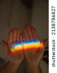 Rainbow Ray On A Woman's Hand. 