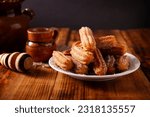 Small photo of Churros. Fried wheat flour dough, a very popular sweet snack in Spain, Mexico and other countries where it is customary to eat them for breakfast or snack accompanied by hot chocolate or coffee.