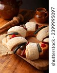 Small photo of Three Kings Bread also called Rosca de Reyes, Roscon, Epiphany Cake, traditionally served with hot chocolate in a clay Jarrito. Mexican tradition on January 5th.