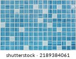 Small photo of texture of small blue ceramic tiles in a chaotic manner background for elite interior of bathroom, wc, lavatory and restroom