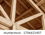 The construction of the wooden roof. Detailed photo of a wooden roof overlap construction.