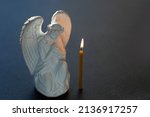 Praying Angel And Candle On...