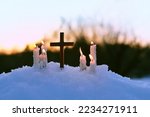 Christian cross and candles on snow, evening winter natural abstract background. Advent time, Christmas holiday. prayer of Peace on Earth. symbol of Religion, Faith in God. festive winter season