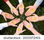 International Friends Day. Happy international friendship day. Top view of eight friends hands. The palms are turned upwards. Smilies are painted on the palms. Right hand. Emoji`s birthday
