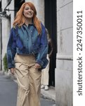 Small photo of Milan, Italy: 7 October 2022: Italian singer Noemi walking in the street in fashion district of Milan, Italy