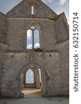 Small photo of Empty gothic aperture in the eroded wall of old ruined Cistercian abbey on the island of Ile de Re, France