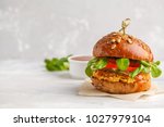 Vegan lentils burger with vegetables and curry sauce. Light background, copy space. Vegan food concept.