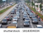 Small photo of Jakarta, Indonesia - July 29, 2020: Traffic jam in the business center and offices main road of Jakarta at busy hours on weekdays after social restriction of pandemic Covid-19