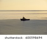 Small photo of A lonely tugboat at sea and undercurrents