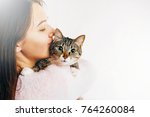 Woman Kisses Beautiful Cat ...