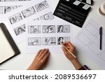 Small photo of The artist draws a storyboard for the film. The director creates the storytelling by sketching footage of the script on paper.