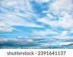 Small photo of Cloudscape. Blue sky with white and gray clouds. Firmament on an overcast day. Natural background. Heaven