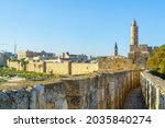 View of the Ramparts Walk, over the old city walls, with the Tower of David (Citadel) and other monuments, in Jerusalem, Israel