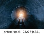 Indide dark round underground sewer tunnel.