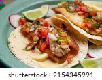 Small photo of Fish tacos with fresh sauce and mayonnaise. Traditional mexican food