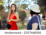 Small photo of Cheated Wife Pointed to a Younger Mistress of her Husband. Older woman accusing a girl of being inappropriate