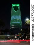 Small photo of Riyadh, Saudi Arabia - March 11 2023: Kingdom Tower illuminated with the National Flag of the Kingdom of Saudi Arabia to mark Saudi Flag Day.