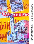Small photo of DEFACED POSTERS MAKING COLOURFUL ABSTRACT DESIGN, LONDON, ENGLAND. OCTOBER 2010. Advertising posters fly posted on city walls defaced and torn from the wall make an interesting decorative abstract.