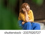 Small photo of Sad plump middle aged woman thinking about something, crisis of middle age and problems among overweight people